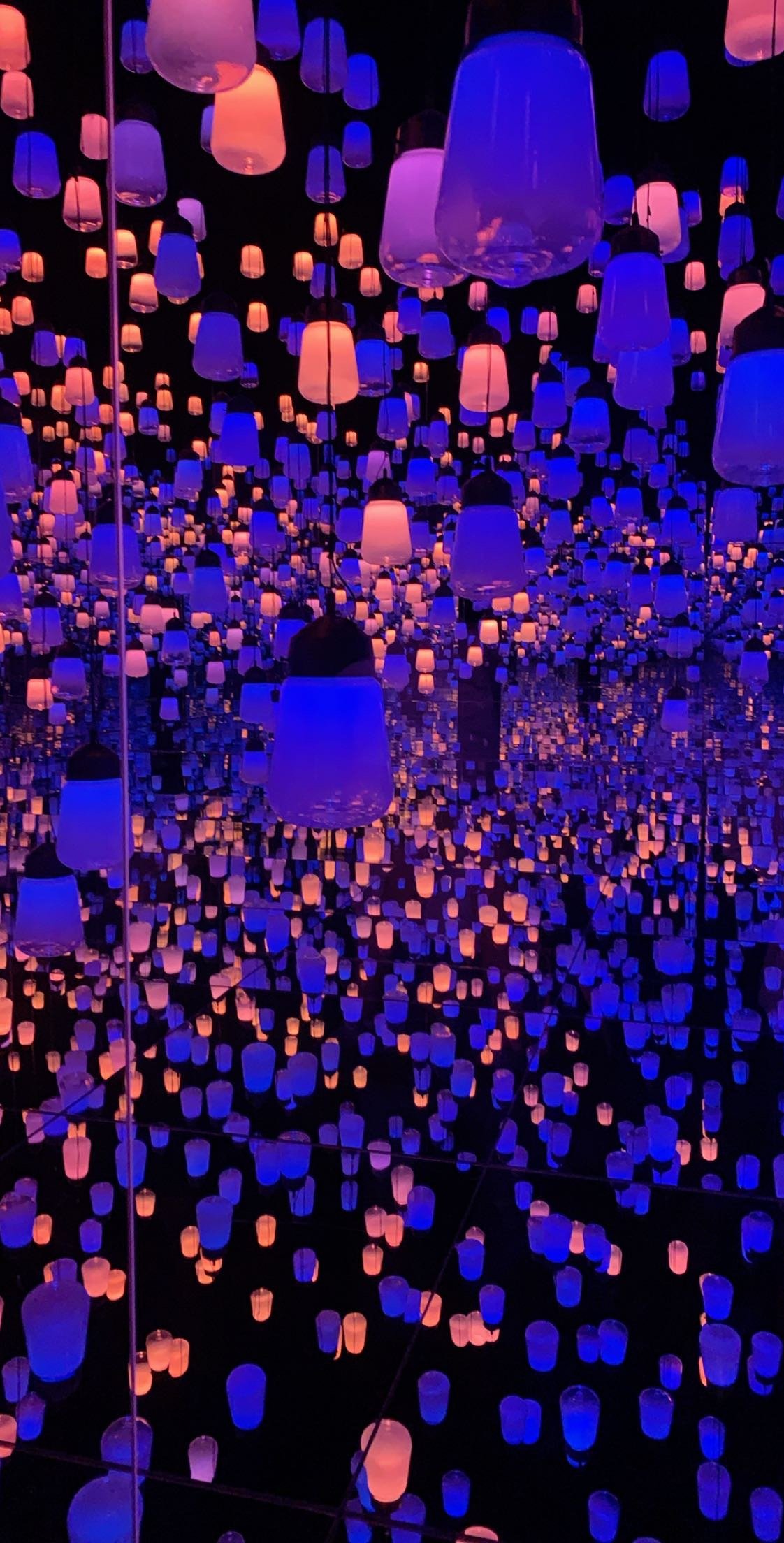 The EPSON TeamLab Borderless exhibit in Tokyo displaying hanging lamps